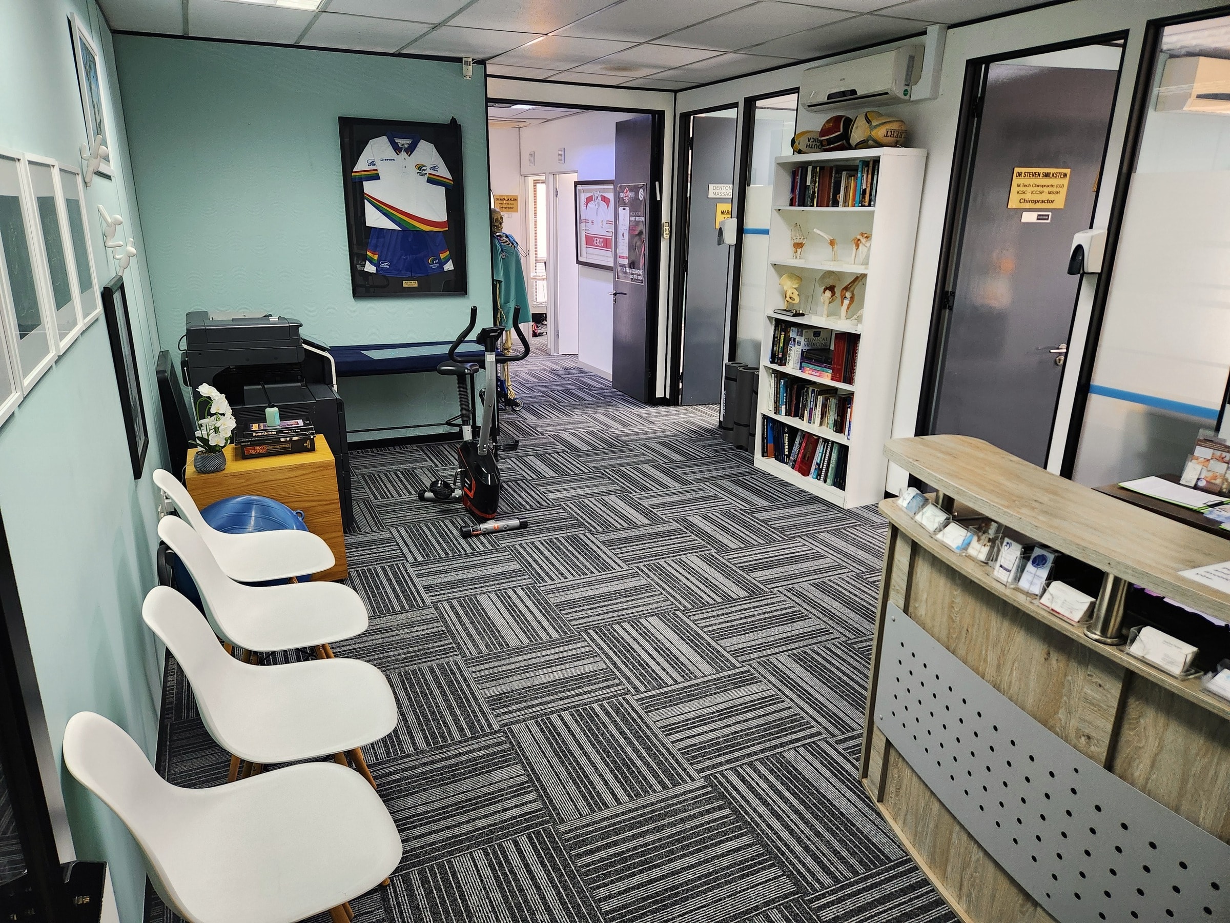 The reception desk and waiting chairs at The Healing Company