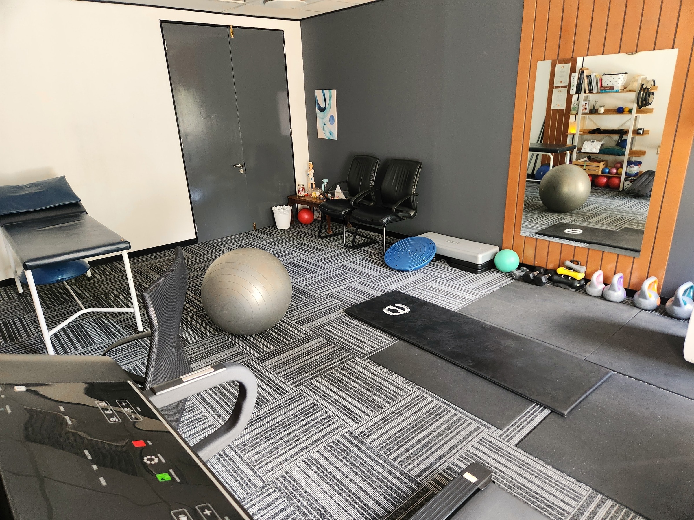 Cayla's exercise room, with the mirror, mats and weights